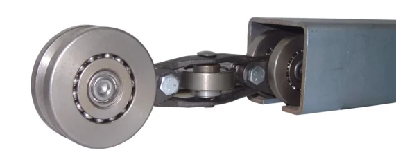 Frost industrial enclosed track chain with full ball complement wheels running in an enclosed track